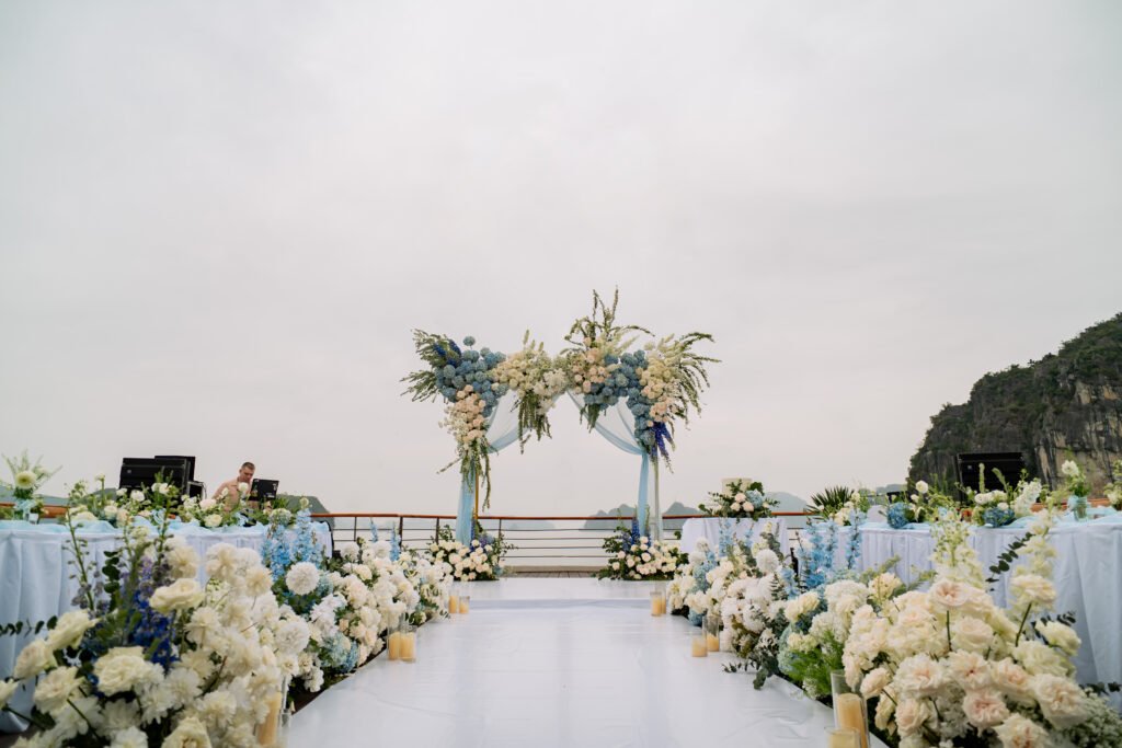 Elegant wedding setup with floral decorations. Destination Wedding in Ha Long Bay: Say “I Do” with Bhaya Cruises in Vietnam