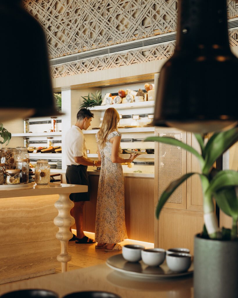 Couple enjoying breakfast with ocean view. Conrad Koh Samui Unveils AOW THAI, A Thoughtful Culinary Experience Rooted in Sustainability