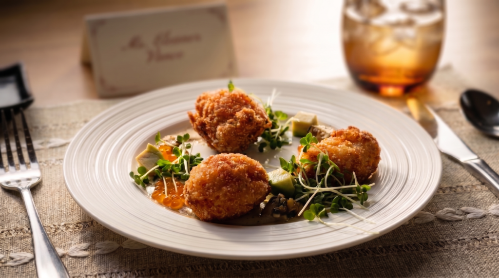 First Light of the Atlantic: Crispy King Crab fritters served with ikura and a lime-yuzu vinaigrette.- NH Collection Maldives Reethi Resort Opens Caravela, a Unique Fine Dining Restaurant