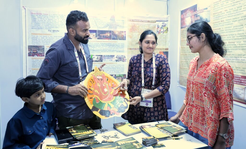 Vipin Viswanatha Pulavar, Ramya Devi and their daughter Mahalakshmi demonstrate the art at the ‘Shadow Puppetry’ stall at kerala travel mart